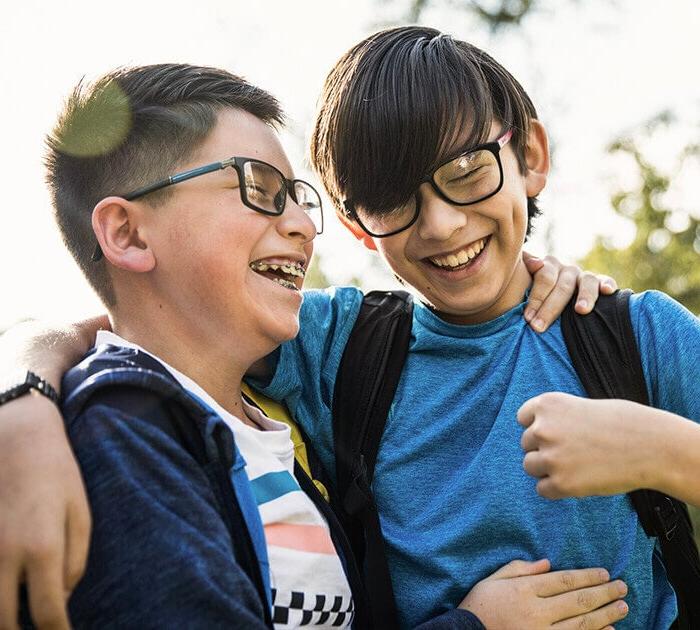 Two young boys laughing together